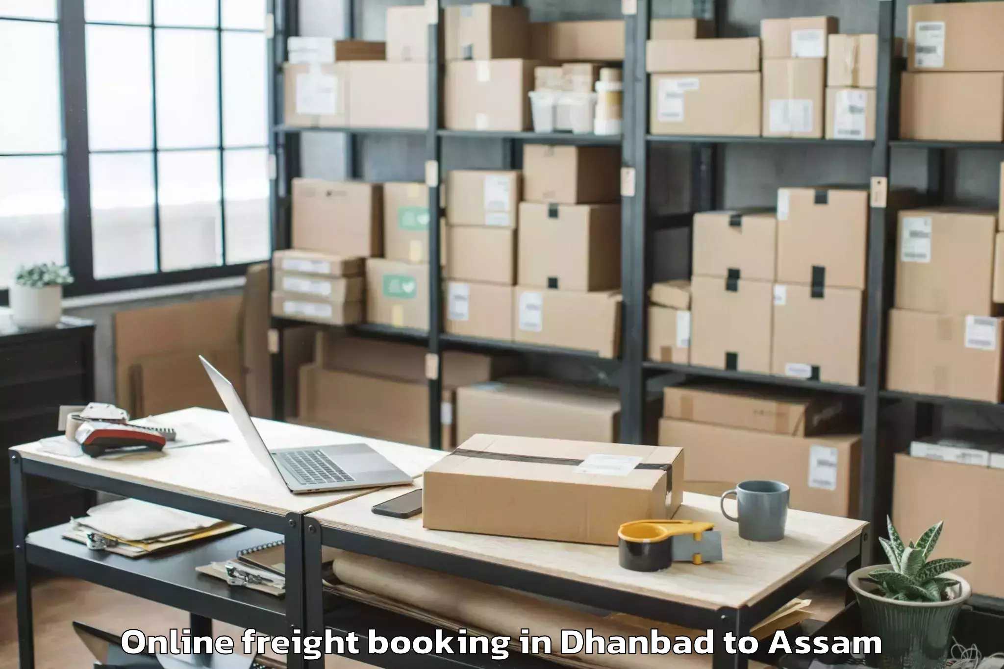 Easy Dhanbad to Darangamela Online Freight Booking Booking